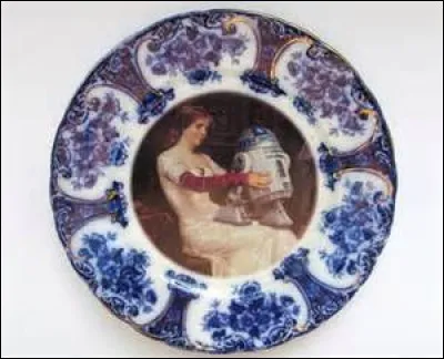 In this picture, who is holding R2-D2?