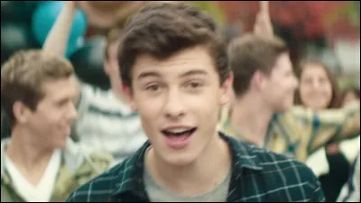 How old was Shawn when he first got his record label, and from who?