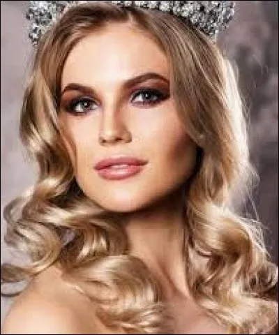 Who is this candidate, and which country does she represent ?