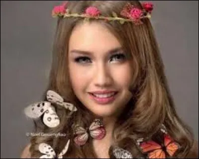 Who is this candidate, and which country does she represent ?