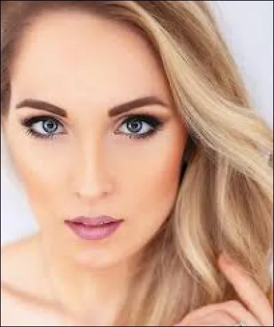 Who is this candidate, and which country does she represent ?