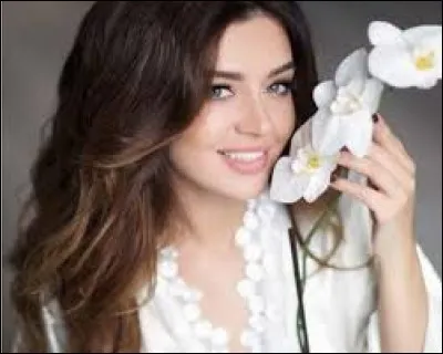 Who is this candidate, and which country does she represent ?