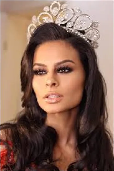 Who is this candidate, and which country does she represent ?