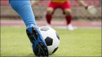 Which famous football team opened its school in Warsaw?