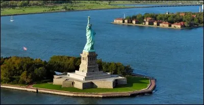 What is the name of the island that houses the statue?