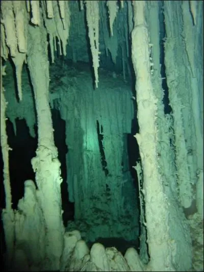What are stalactites and stalagmites in caves made of?