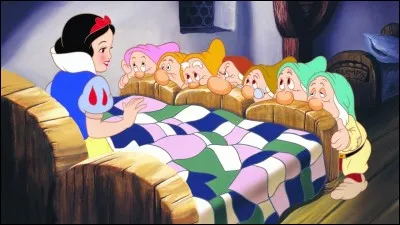In what year was the first animated feature film and "animated classic" of the Disney studios "Snow White and the Seven Dwarfs" released?