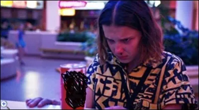 In season 3, what drink are Lucas and the others talking about in the store while Eleven is looking for Dustin?