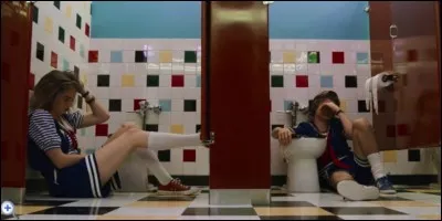 What does Robin confess to Steve in the bathroom?