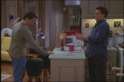 How much money does Chandler lose in the 'cup game' against Joey?