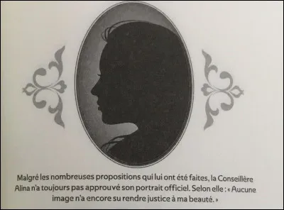 Who is this Councillor who finds that none of the paintings really depict her natural beauty?
Hint: the answer is on the picture.