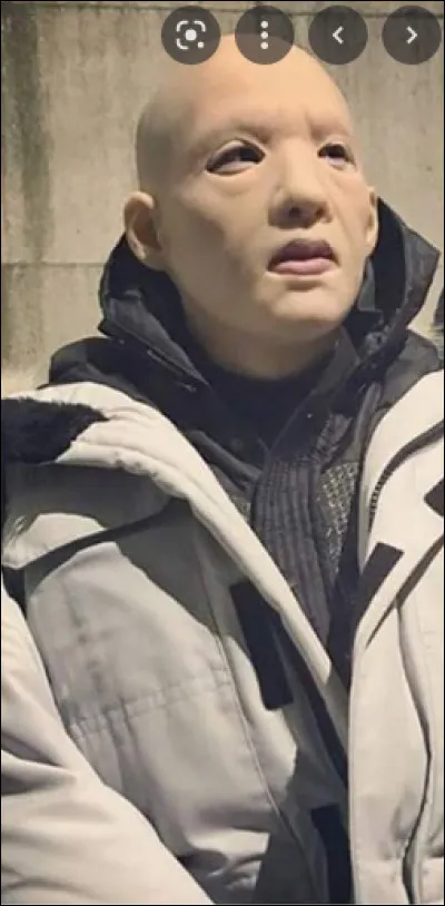 Why does the masked man kidnap women and lock them in cages?