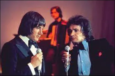 Is Michel Sardou older or younger than Serge Lama?