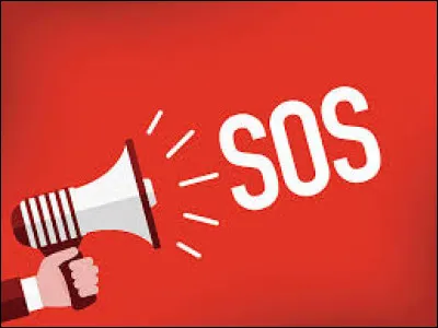 In the film Le Pere Noel est une ordure , who is in charge of the SOS Detresse Amitie switchboard?