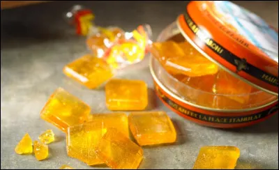 Bergamot de Nancy is a slightly acidic, square, flat, translucent, golden candy.