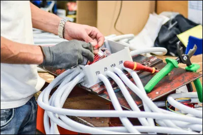 When the electrician makes the wire connections for electrical cables, he does so...