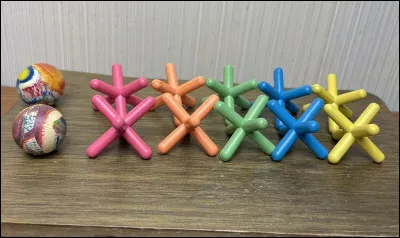 What is the traditional Filipino game using five small stones?