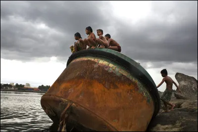 Which Philippine river has a natural flame caused by methane seeping through the water?