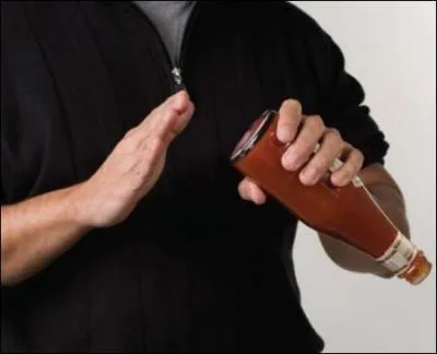 Which of Newton's laws are you using when you hit the bottom of the ketchup bottle to get the ketchup out?