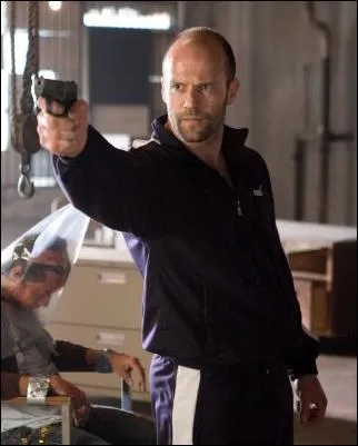 Jason Statham Holding a Gun in...