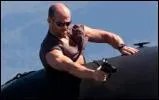 Jason Statham Holding a Gun in...