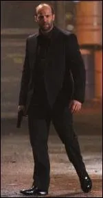 Jason Statham Holding a Gun in...
