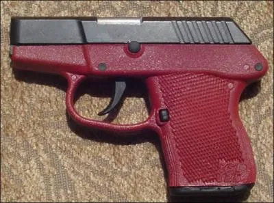 Is the pictured gun an airsoft gun, real steel gun, or paintball gun?