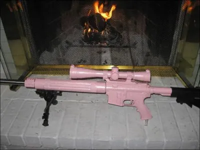 Is the pictured gun an airsoft gun, real steel gun, or paintball gun?