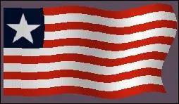 If you see a flag with 11 horizontal white and red stripes and a blue rectangle at the top left with a white star, you are probably at ---------.