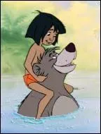 What is the name of the big, carefree bear who becomes Mowgli's friend?
