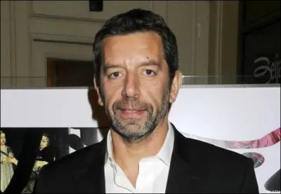 In addition to being a TV host, what is Michel Cymes' other profession?