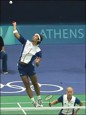 A badminton player practicing the overhead clear and moving a step back each time he hits 5 successfully to the back of the court would be showing signs of what in his training?