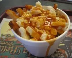 What fast food was created by mixing french fries with cheese curds?