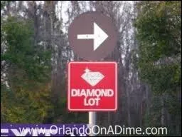 How many ticket days must member's purchase to receive a Disney Diamond parking voucher?