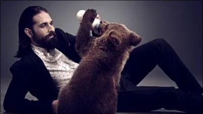 The dating site is launching a new campaign in which its TV spots feature a man and his animal counterpart (in the image, the bearded hipster and the bear). What's this site called?