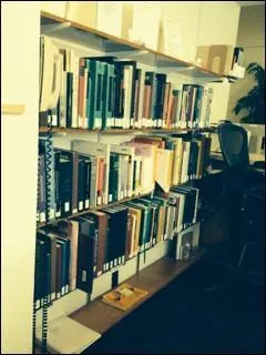 Course Reserve books are shelved behind the circ desk.