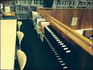 The most current (newest) periodicals are shelved in the racks by the upstairs computers.