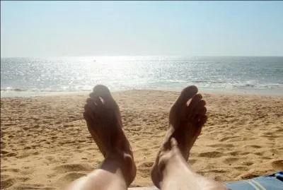Yesterday, my friend and I ... on the beach the whole afternoon.