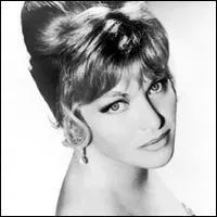 Numb under the snow, she awaits the return of spring. Line Renaud will take her darling there and it will be paradise. What is this song ?