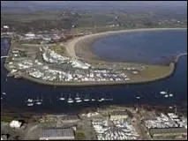 On which part of the coast can Pwllheli be found?