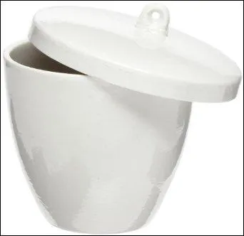 Small lidded porcelain container used for heating small amounts of solids
