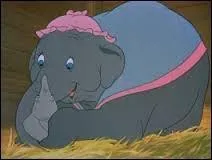 What does Dumbo's mother do to a child who makes fun of the elephant?