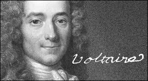 What is written on the plaque in Voltaire's former bedroom?