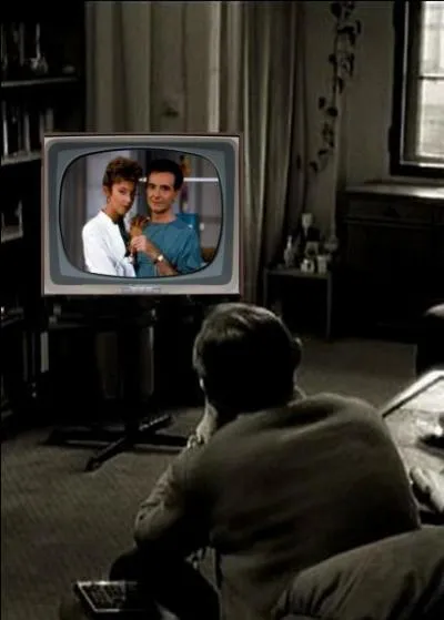 What is that man watching on television?